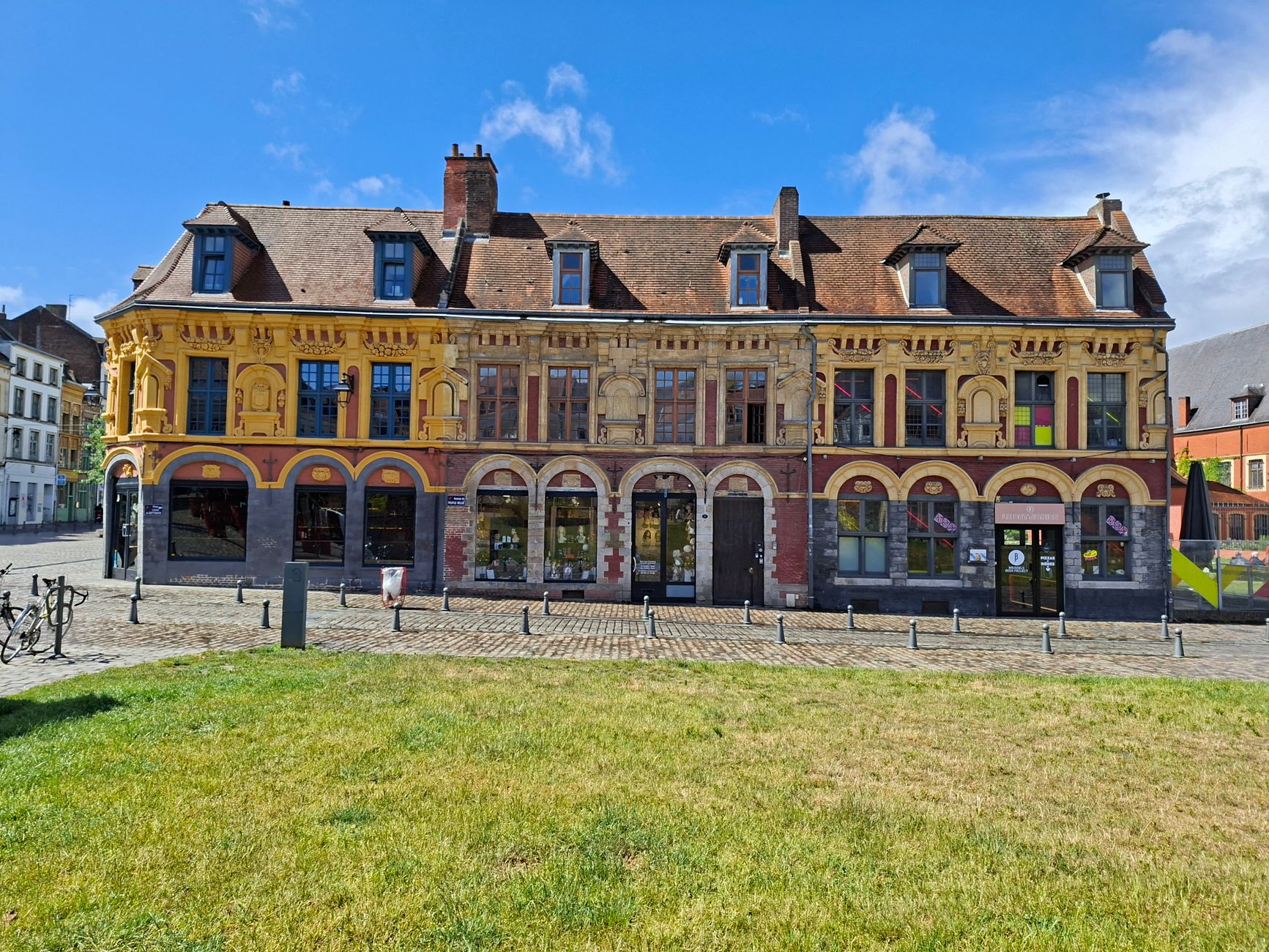 Charming Flemish-style building in Lille's scenic old town square.